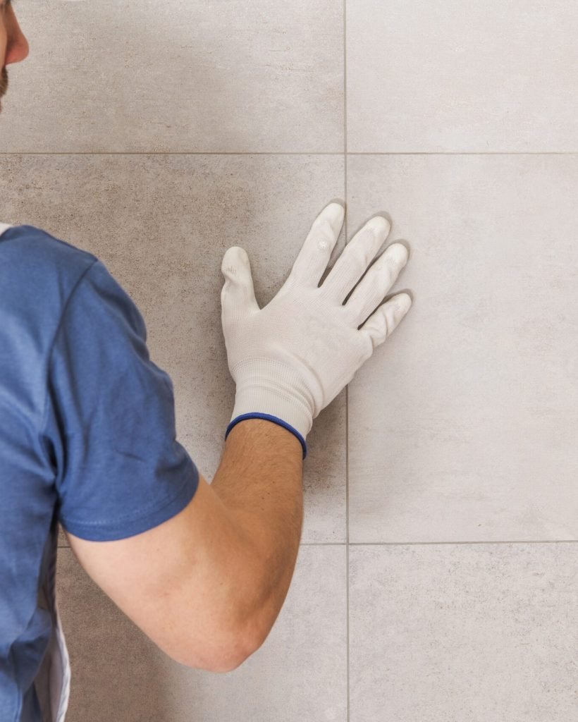 Bathroom Ceramic Tiles Wall Final Check by Professional Installer.